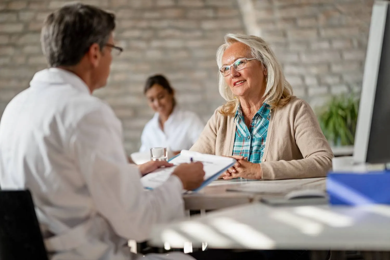 An older woman smiling during a friendly conversation