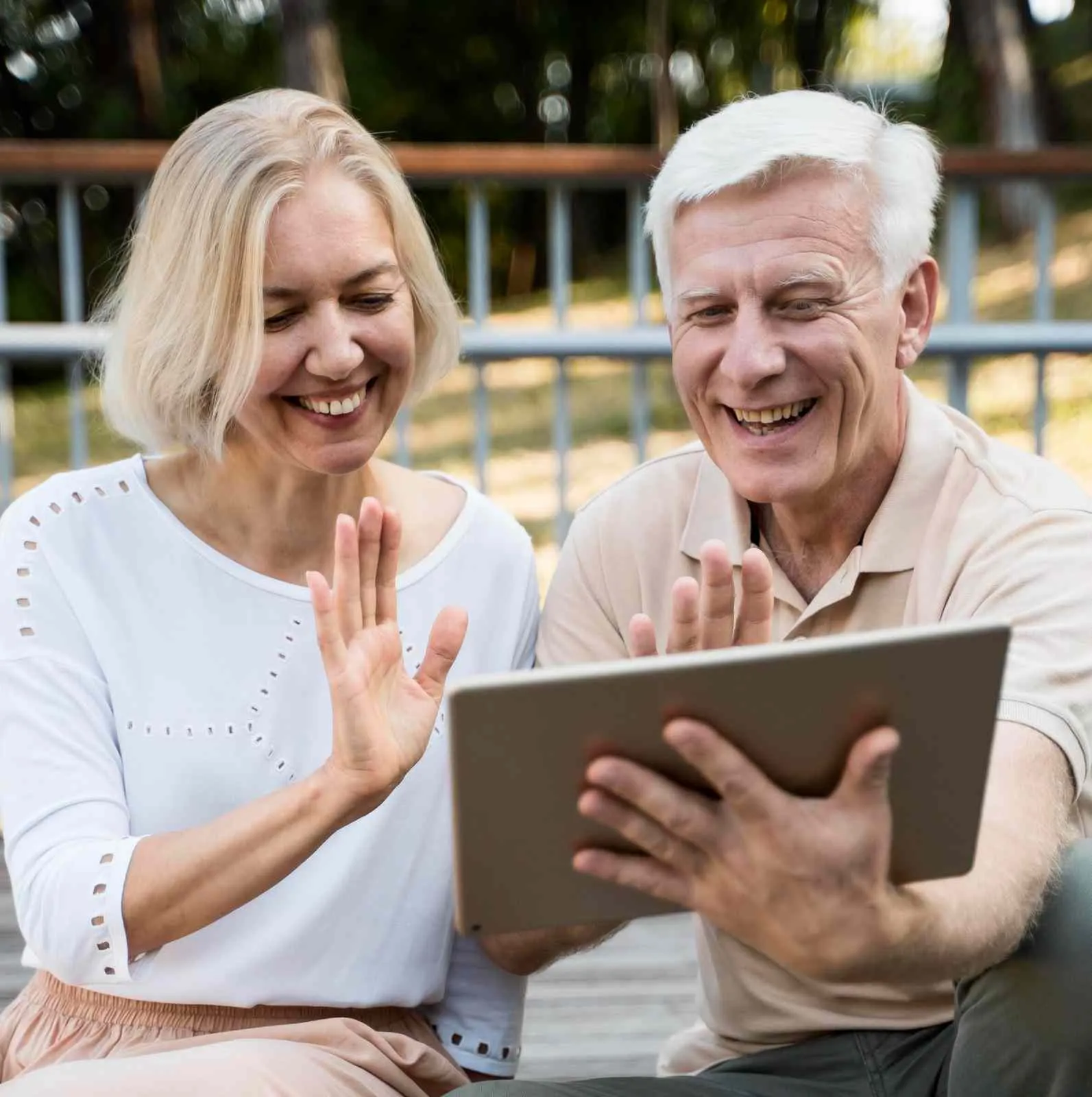 An older couple reading through health coverage paperwork at home
